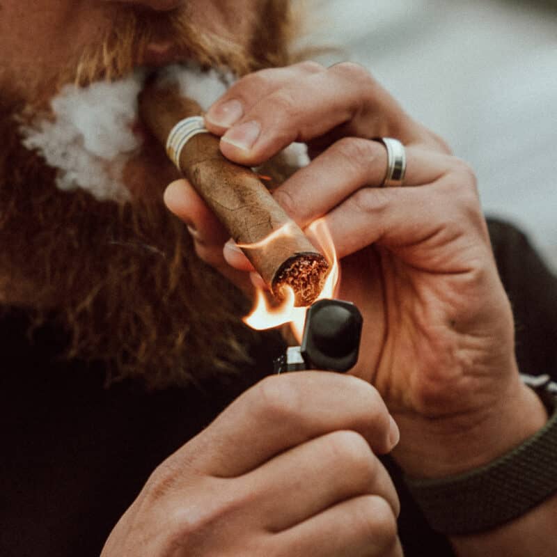 https://founderscigarco.com/wp-content/uploads/2021/09/lighting-cigar-square-800x800.jpg